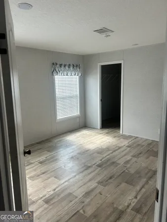an empty room with a natural light