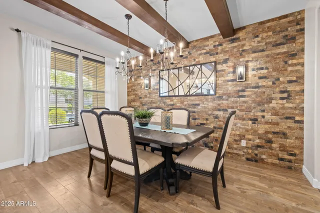 a view of a dining room with furniture and a window