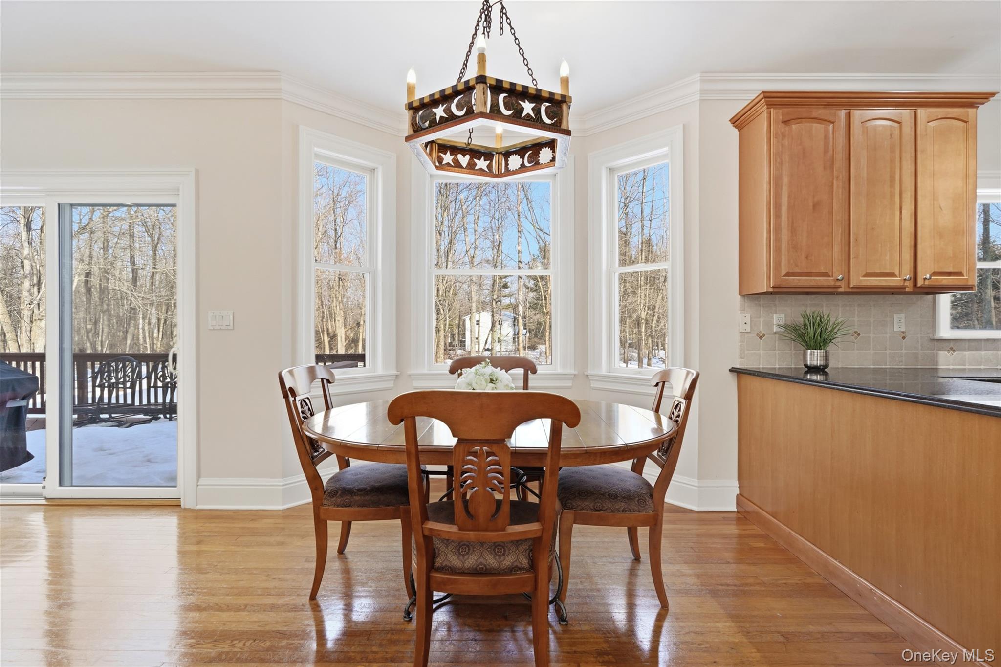 127 Smith Ridge Road South Salem, NY 10590 - Photo 16 of 49 a dining room with furniture a chandelier and wooden floor