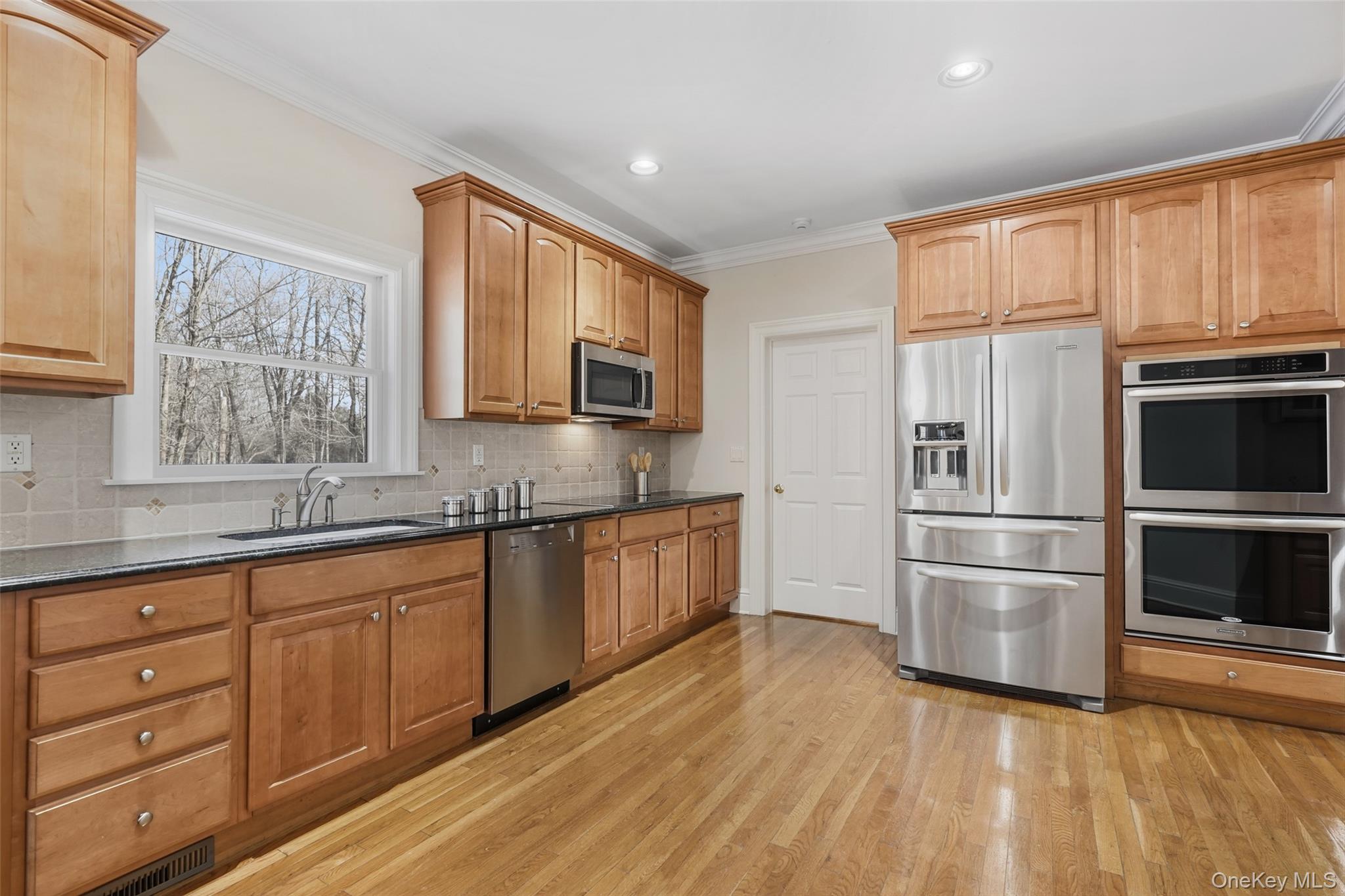 127 Smith Ridge Road South Salem, NY 10590 - Photo 18 of 49 a kitchen with stainless steel appliances granite countertop a refrigerator microwave and sink
