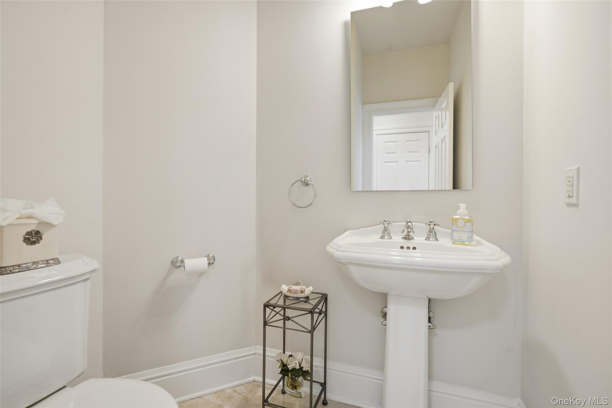 127 Smith Ridge Road South Salem, NY 10590 - Photo 22 of 49 a bathroom with a sink a toilet and mirror