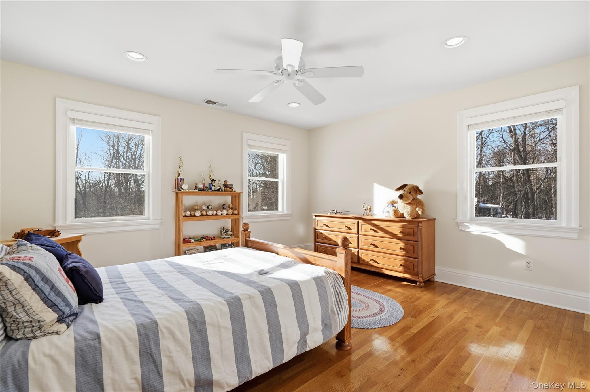 127 Smith Ridge Road South Salem, NY 10590 - Photo 29 of 49 a bedroom with a bed and wooden floor