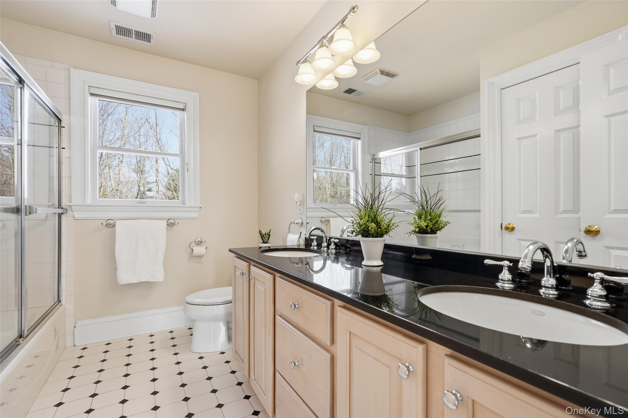 127 Smith Ridge Road South Salem, NY 10590 - Photo 32 of 49 a bathroom with a granite countertop sink a toilet a mirror and shower