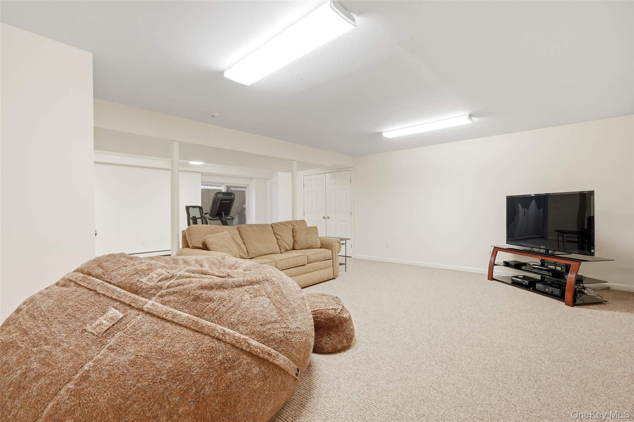 127 Smith Ridge Road South Salem, NY 10590 - Photo 33 of 49 a bed room with a bed and a flat screen tv