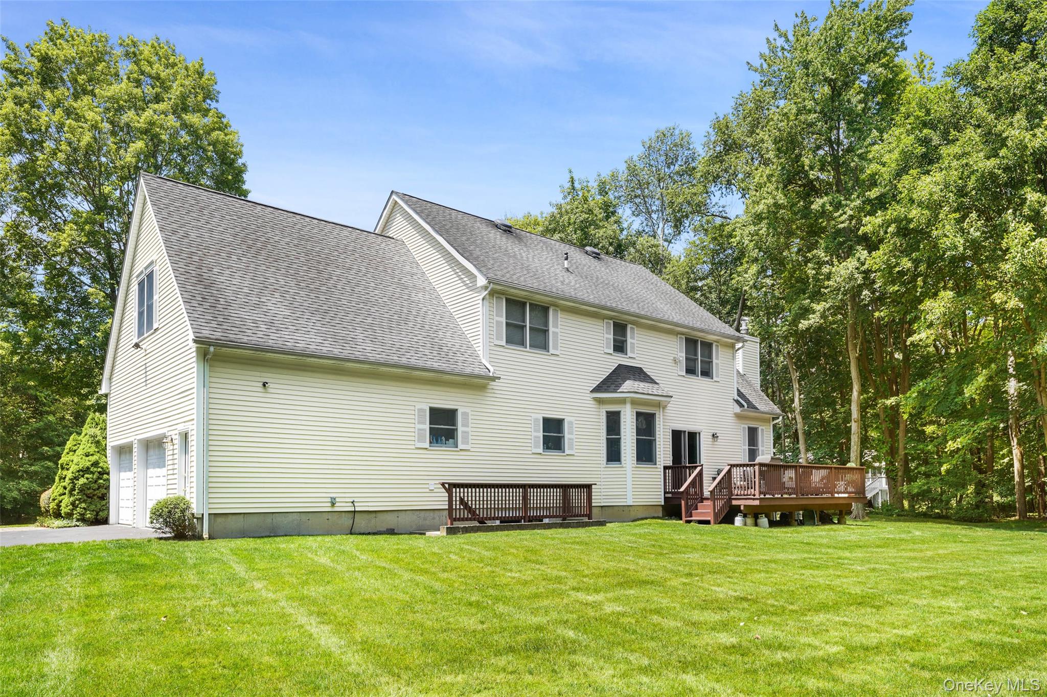 127 Smith Ridge Road South Salem, NY 10590 - Photo 40 of 49 a view of a white house with a big yard and large trees