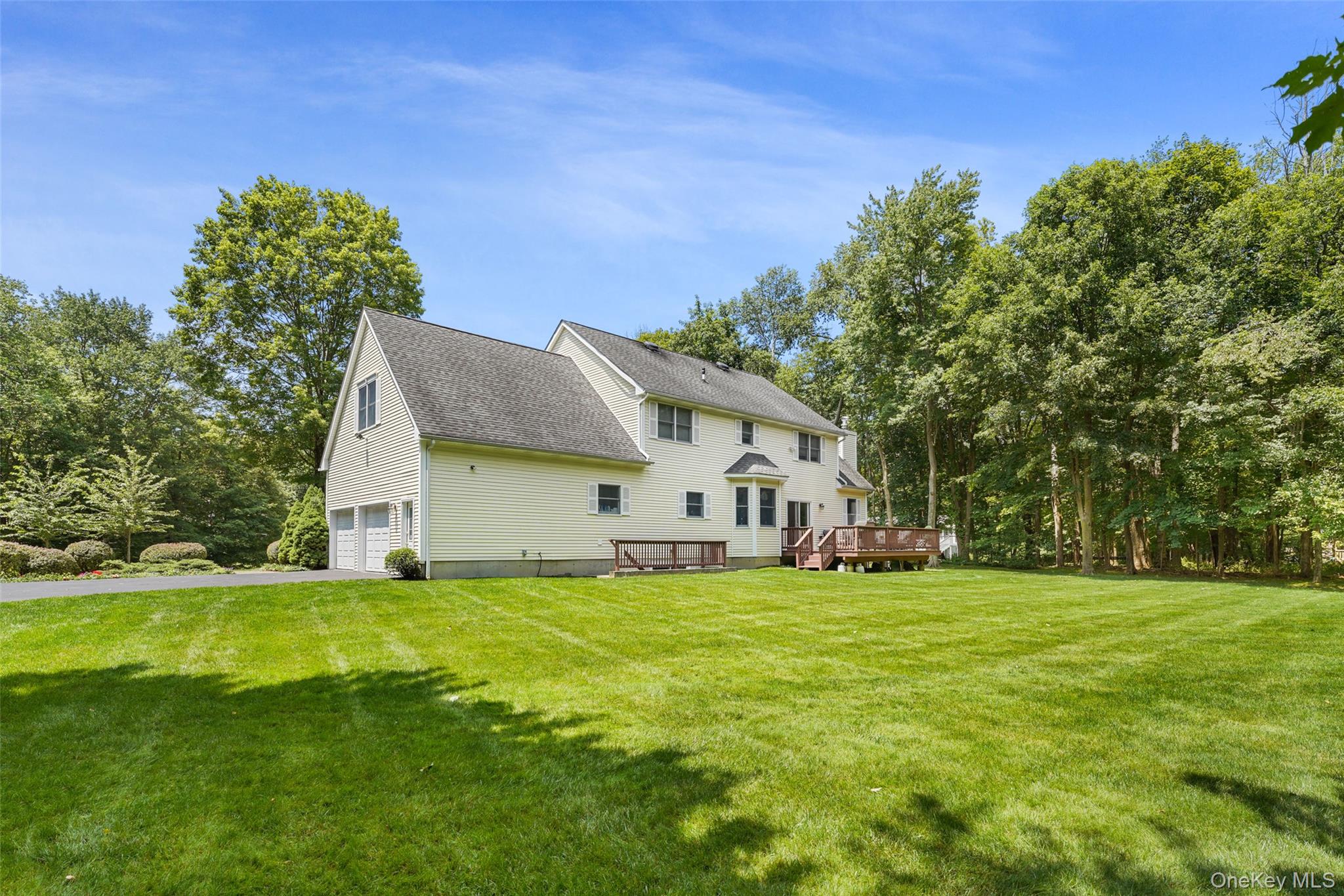 127 Smith Ridge Road South Salem, NY 10590 - Photo 42 of 49 a white house with a big yard and large trees