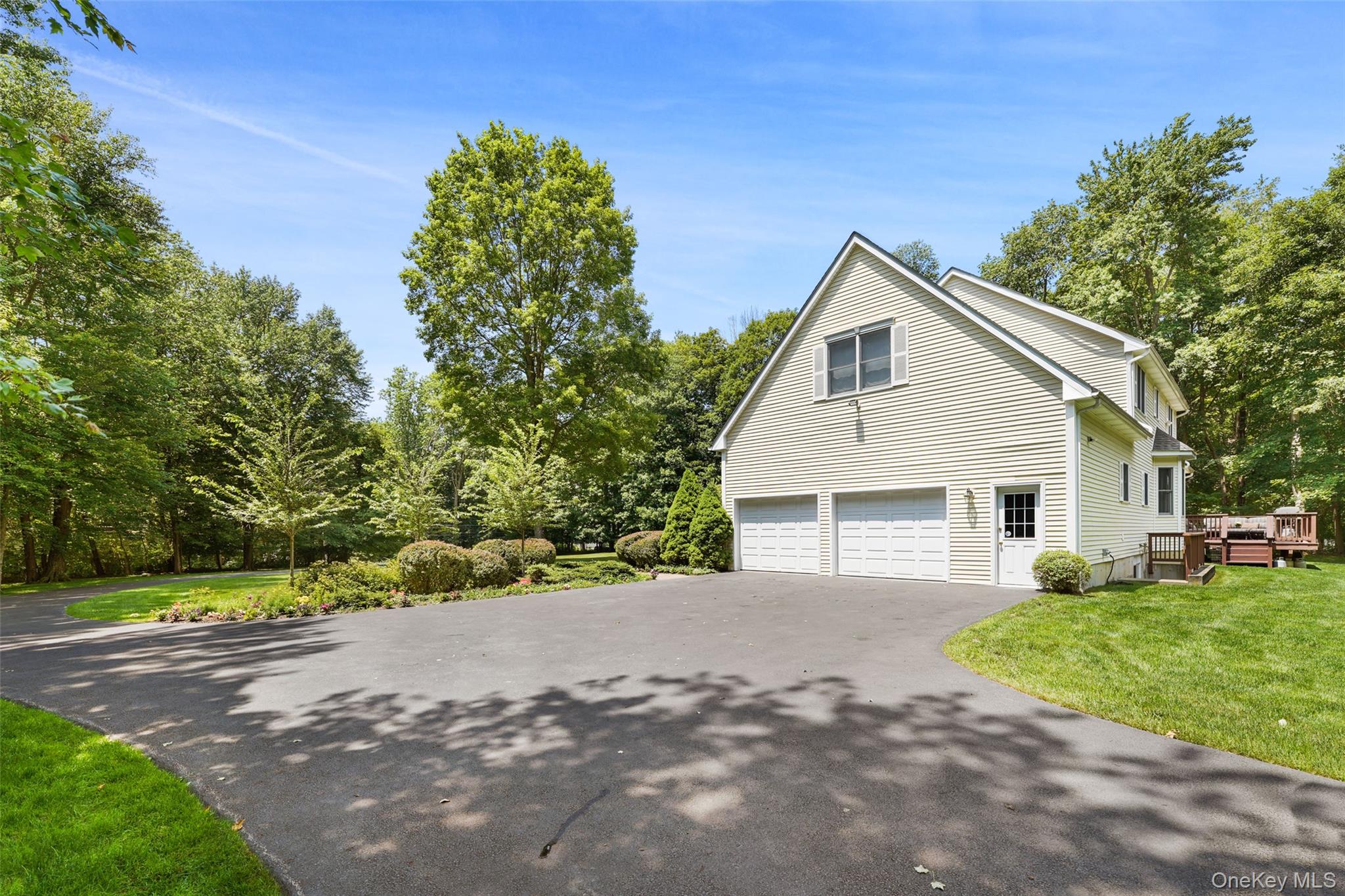127 Smith Ridge Road South Salem, NY 10590 - Photo 44 of 49 a front view of a house with a yard and garage