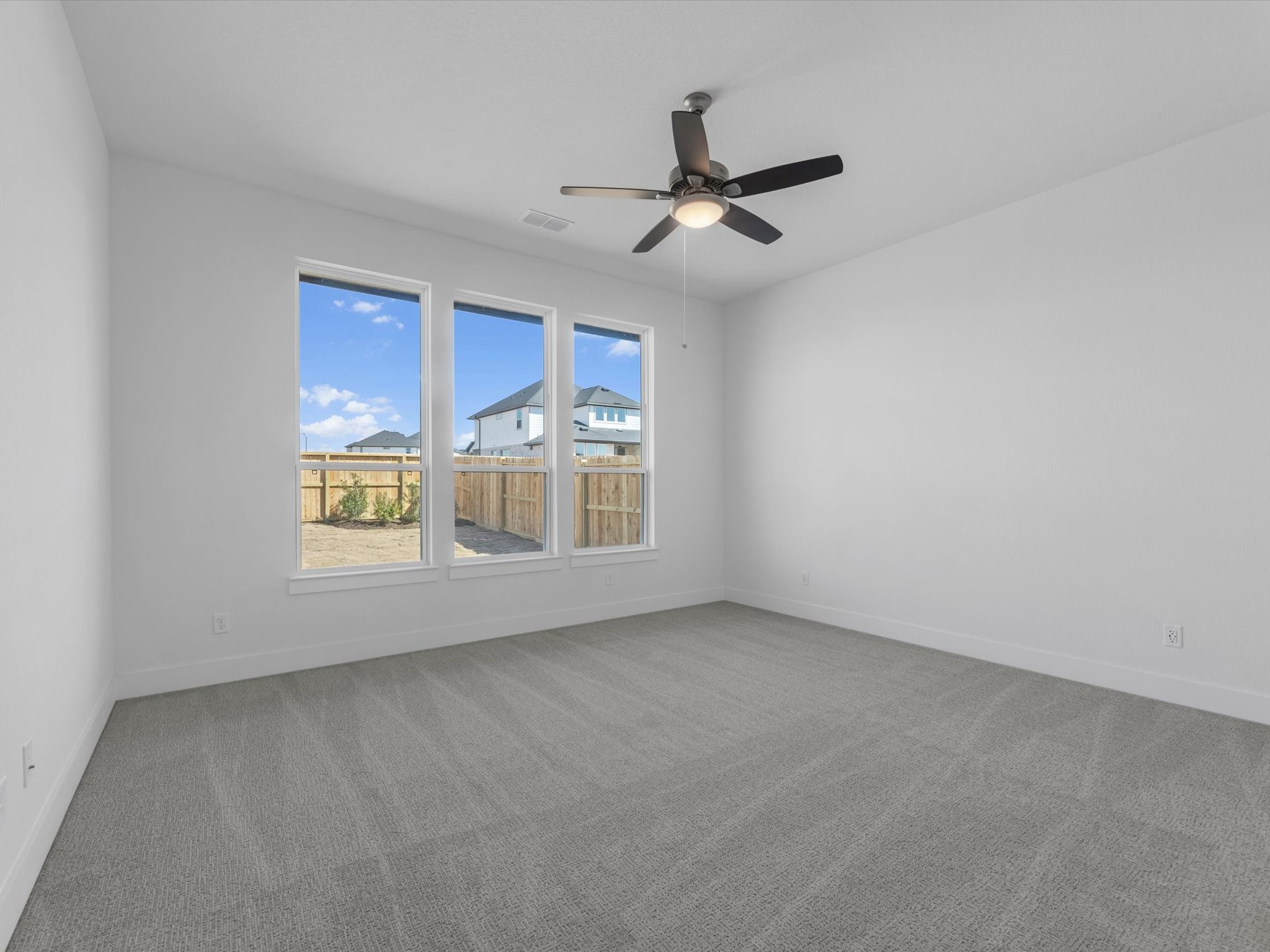 8011 Sunny Rdg Drive Fulshear, TX 77441 - Photo 11 of 32 a view of an empty room with a window