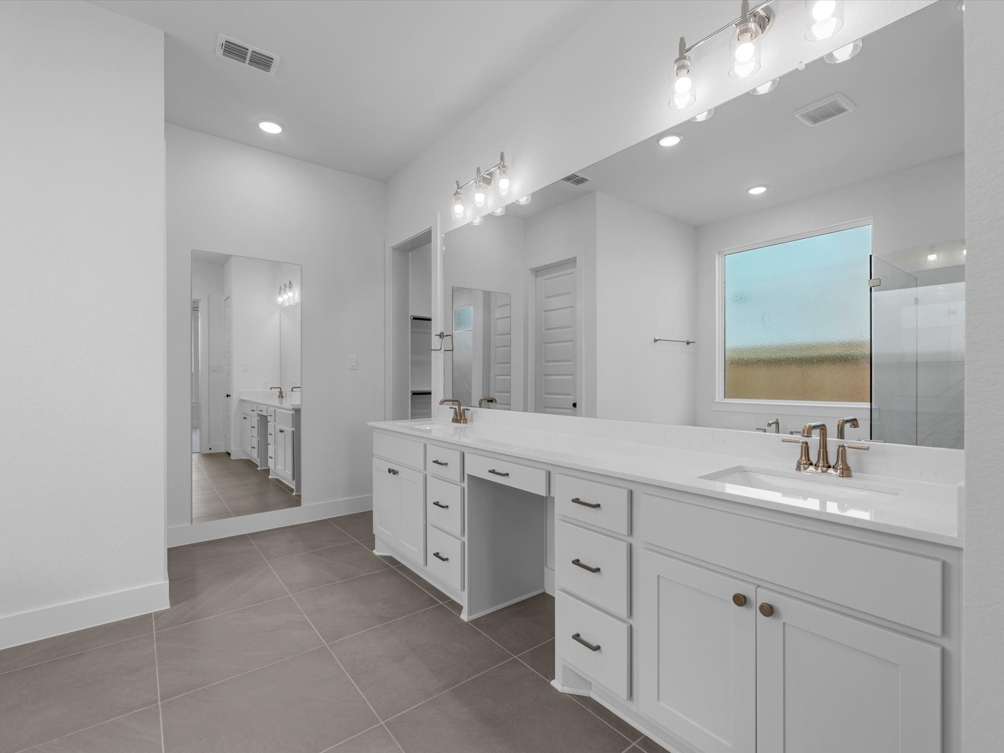 8011 Sunny Rdg Drive Fulshear, TX 77441 - Photo 12 of 32 a bathroom with a double vanity sink mirror and double