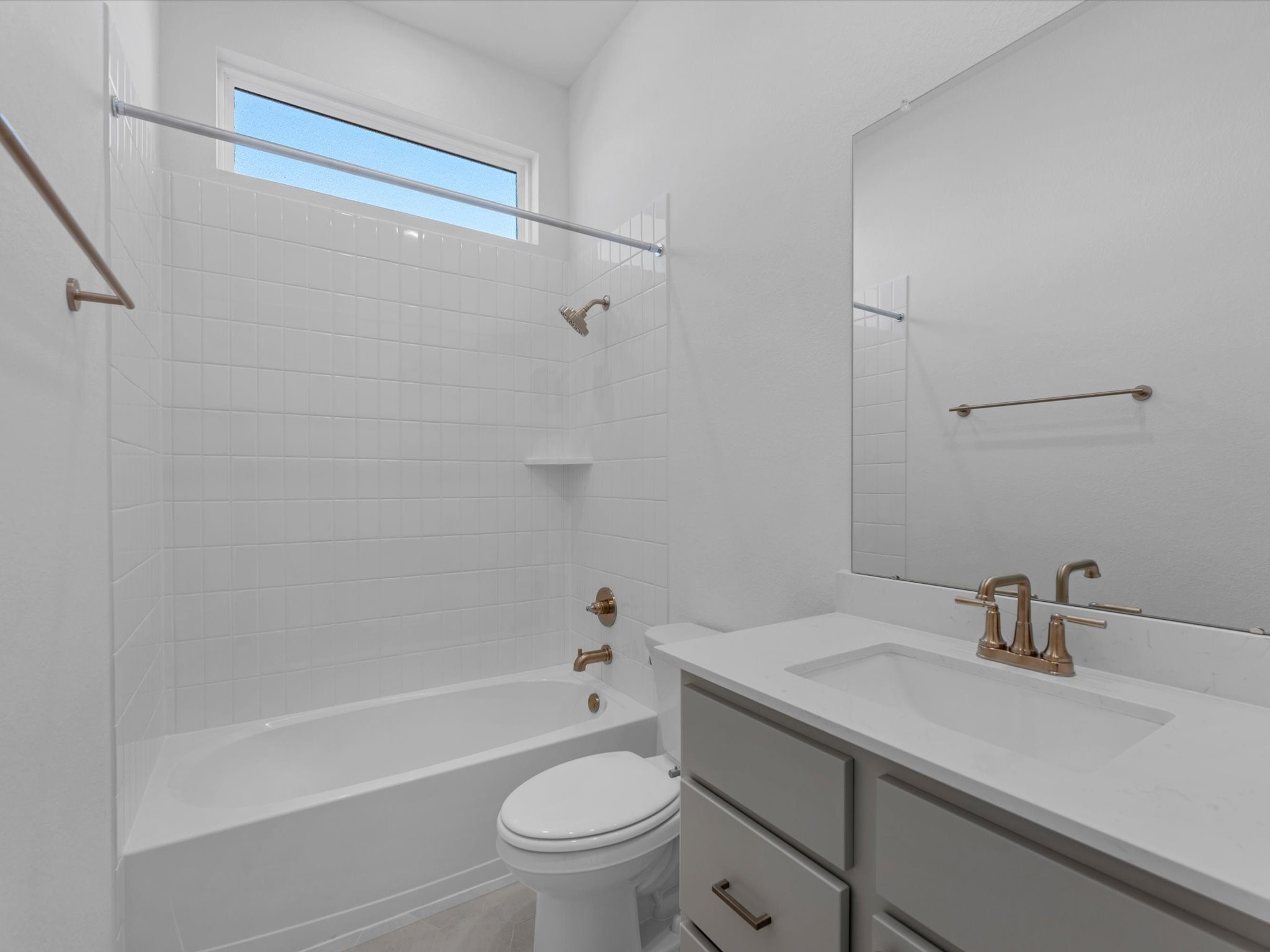 8011 Sunny Rdg Drive Fulshear, TX 77441 - Photo 15 of 32 a bathroom with a sink a toilet and a bathtub