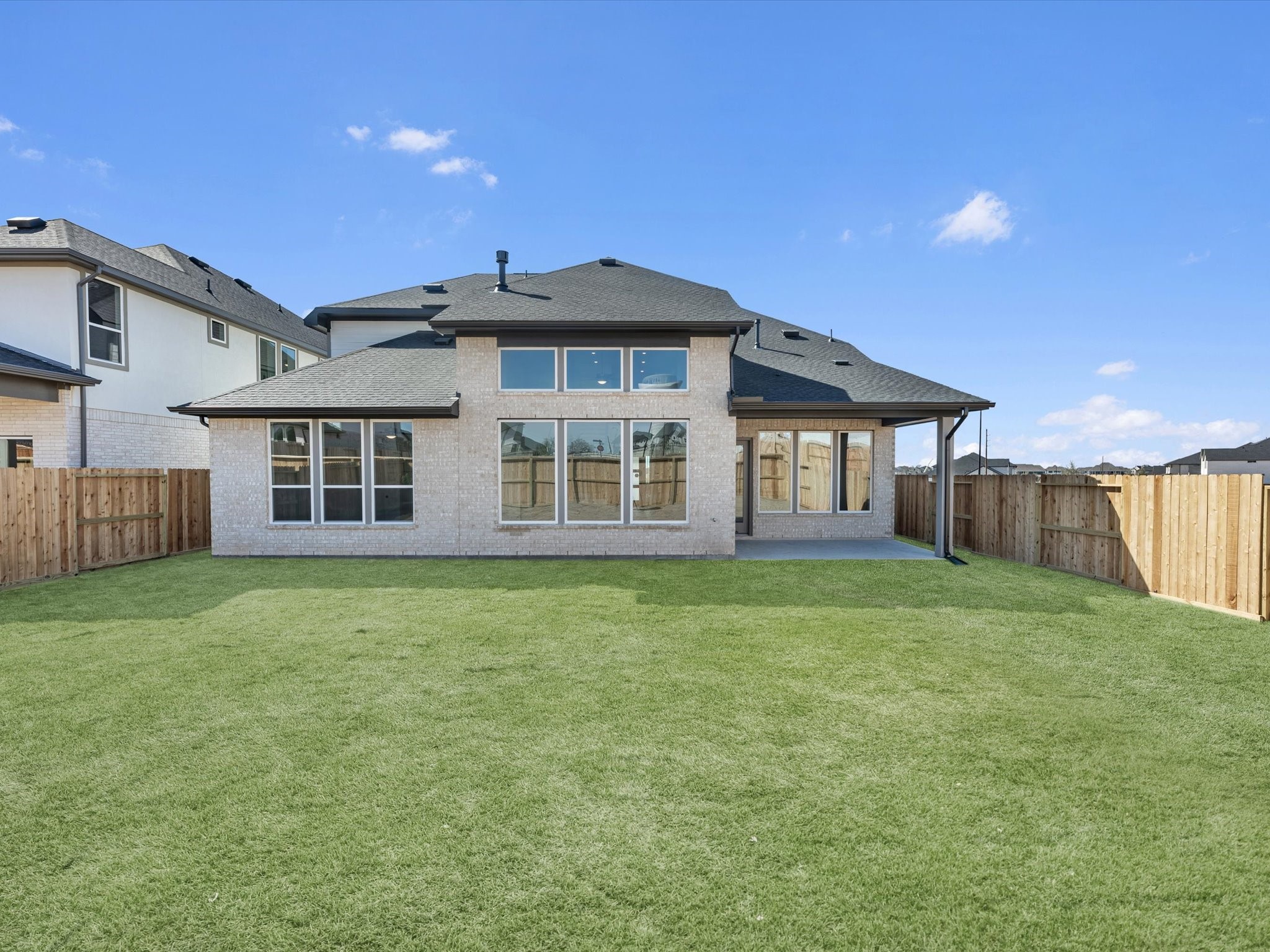 8011 Sunny Rdg Drive Fulshear, TX 77441 - Photo 20 of 32 a front view of a house with a garden