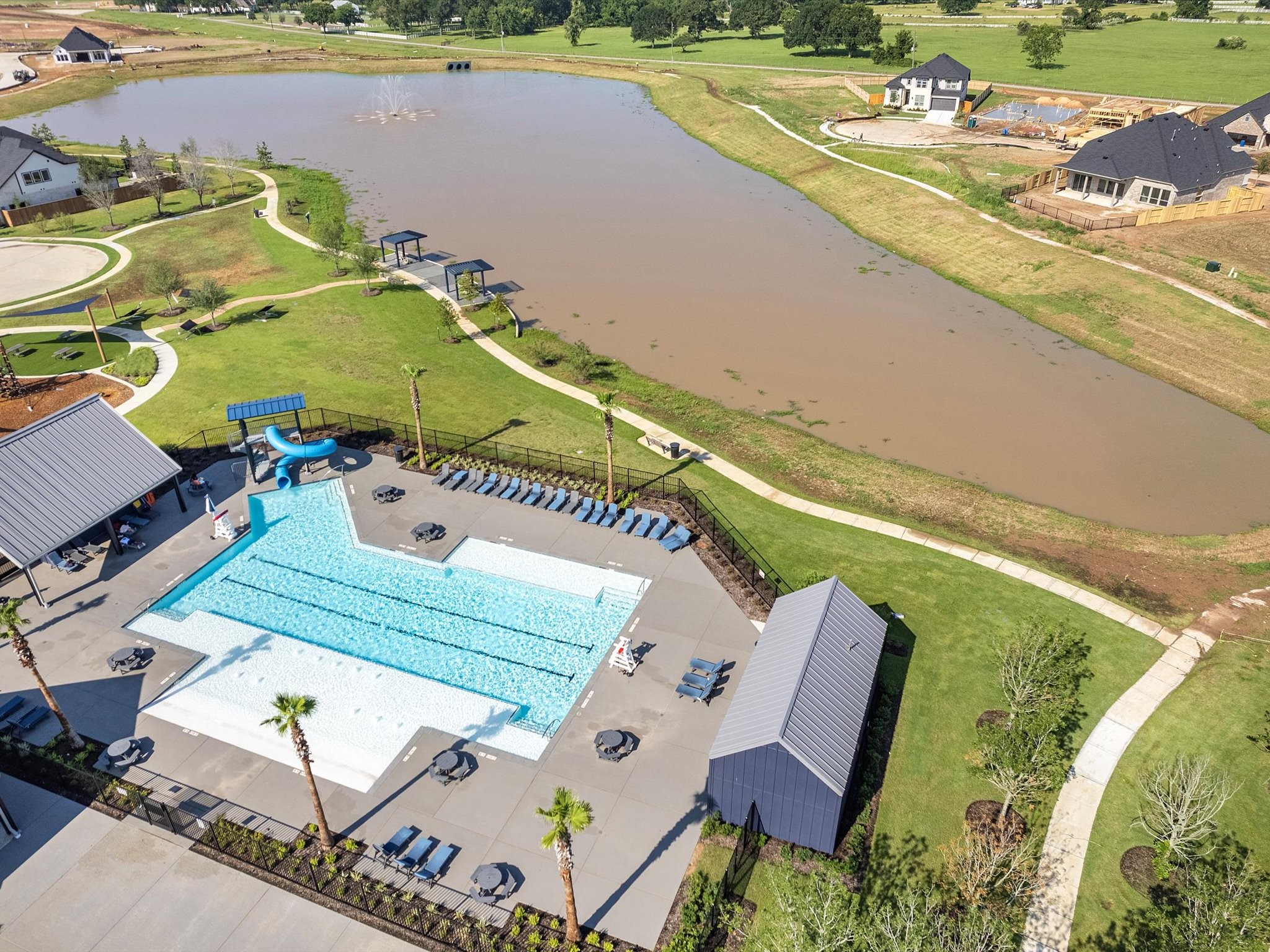 8011 Sunny Rdg Drive Fulshear, TX 77441 - Photo 26 of 32 an aerial view of a house with a swimming pool