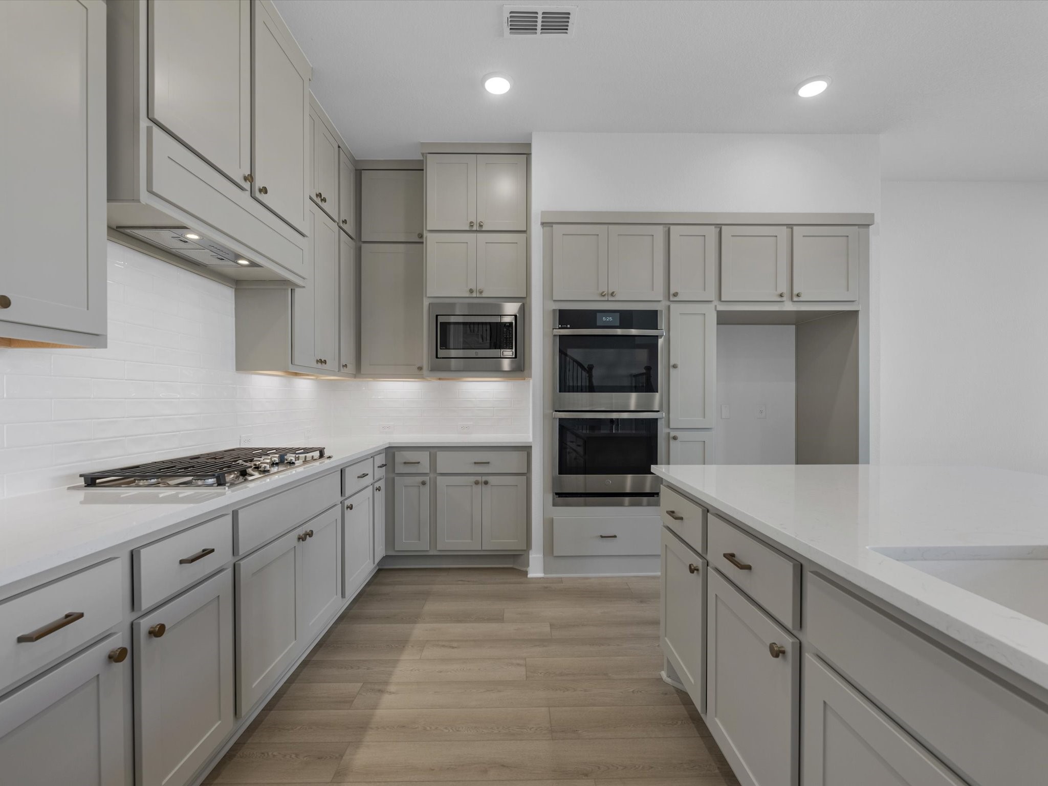 8011 Sunny Rdg Drive Fulshear, TX 77441 - Photo 3 of 32 a kitchen with stainless steel appliances granite countertop a refrigerator and a sink