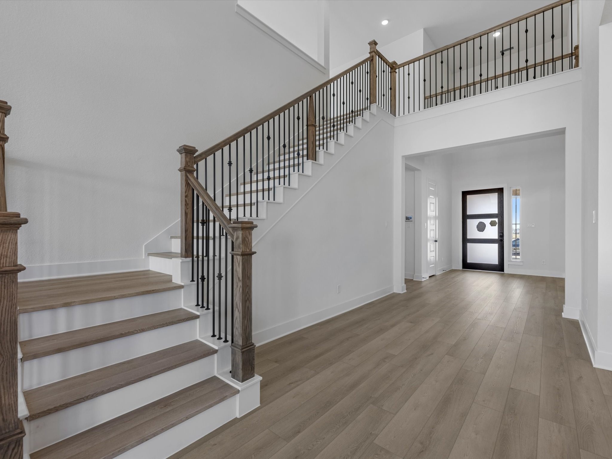 8011 Sunny Rdg Drive Fulshear, TX 77441 - Photo 7 of 32 a view of staircase with white walls and a window