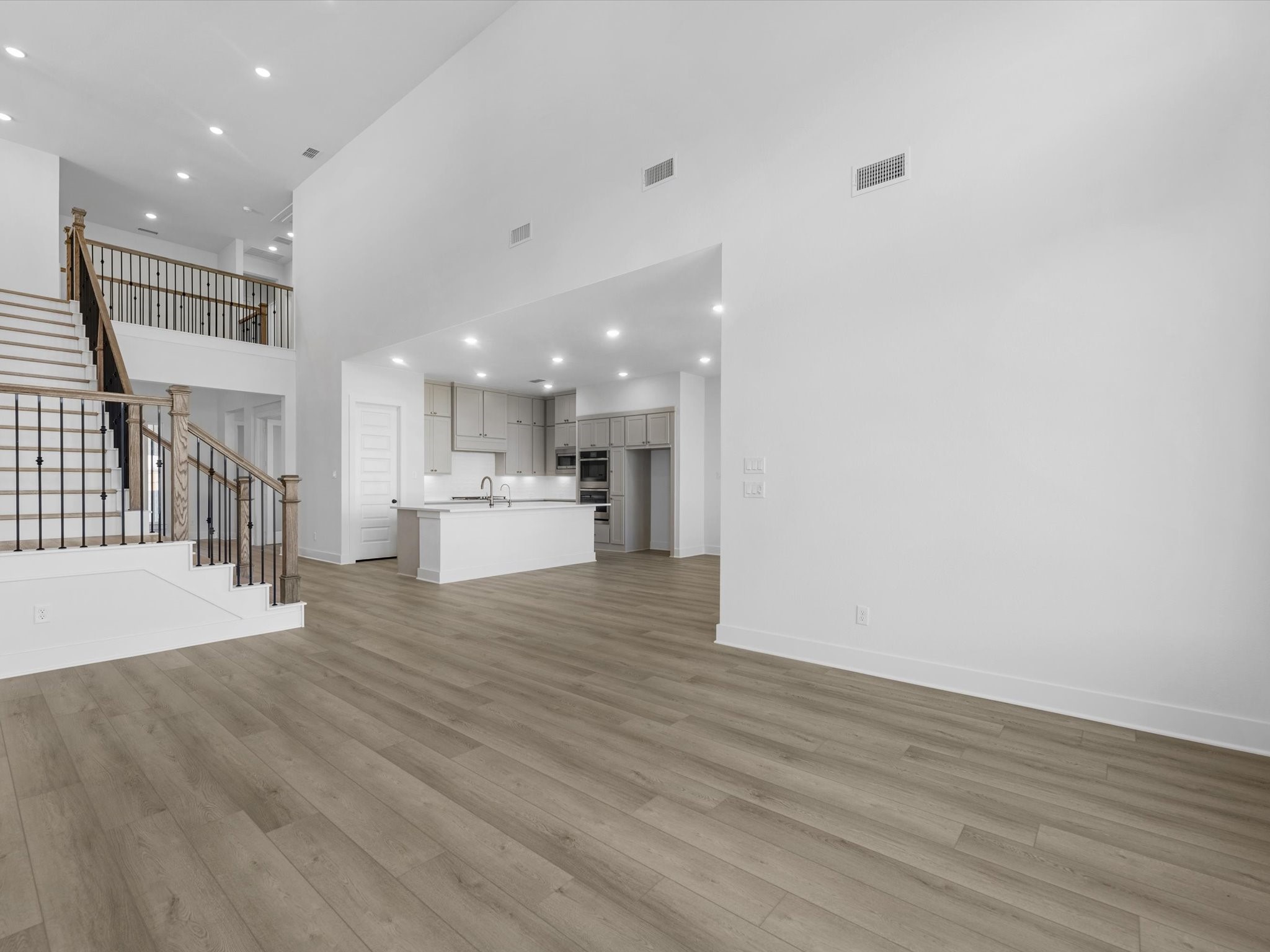 8011 Sunny Rdg Drive Fulshear, TX 77441 - Photo 9 of 32 a view of kitchen with wooden floor and a sink