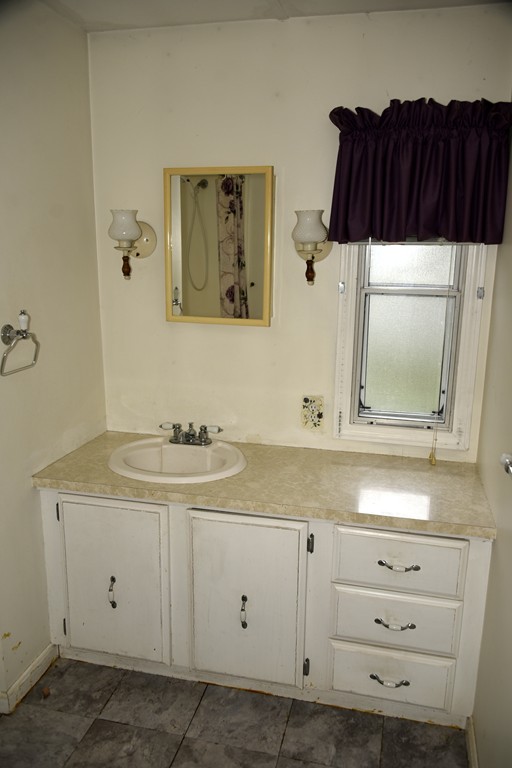 1 Judith Street Wareham, MA 02576 - Photo 5 of 7 a bathroom with a sink and a mirror