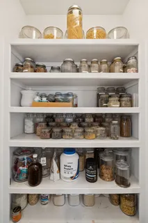 a shelf with cup and plates