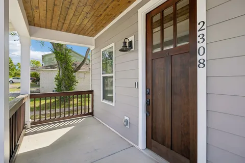 a view of a porch with wooden floor and outdoor space