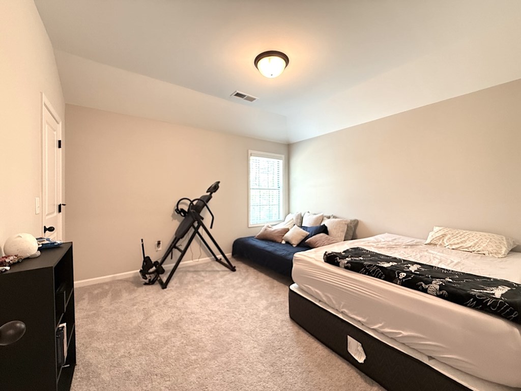 33 Sugar Maple Drive Fort Mitchell, AL 36856 - Photo 22 of 29 a bedroom with bed and a window