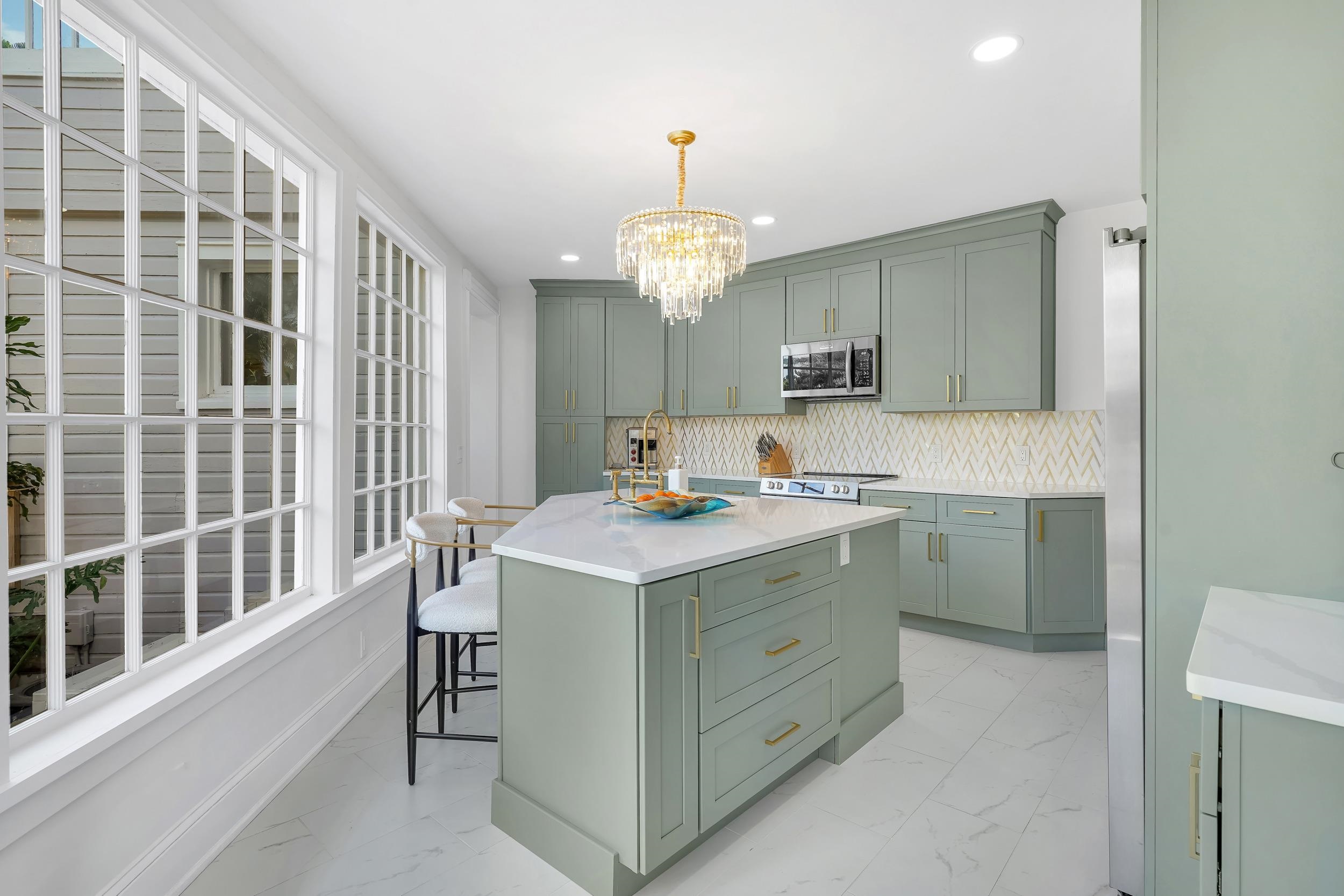 268 St George Street St. Augustine, FL 32084 - Photo 16 of 71 Kitchen featuring a center island, tasteful backsplash, light marble finish flooring, pendant lighting, and recessed lighting