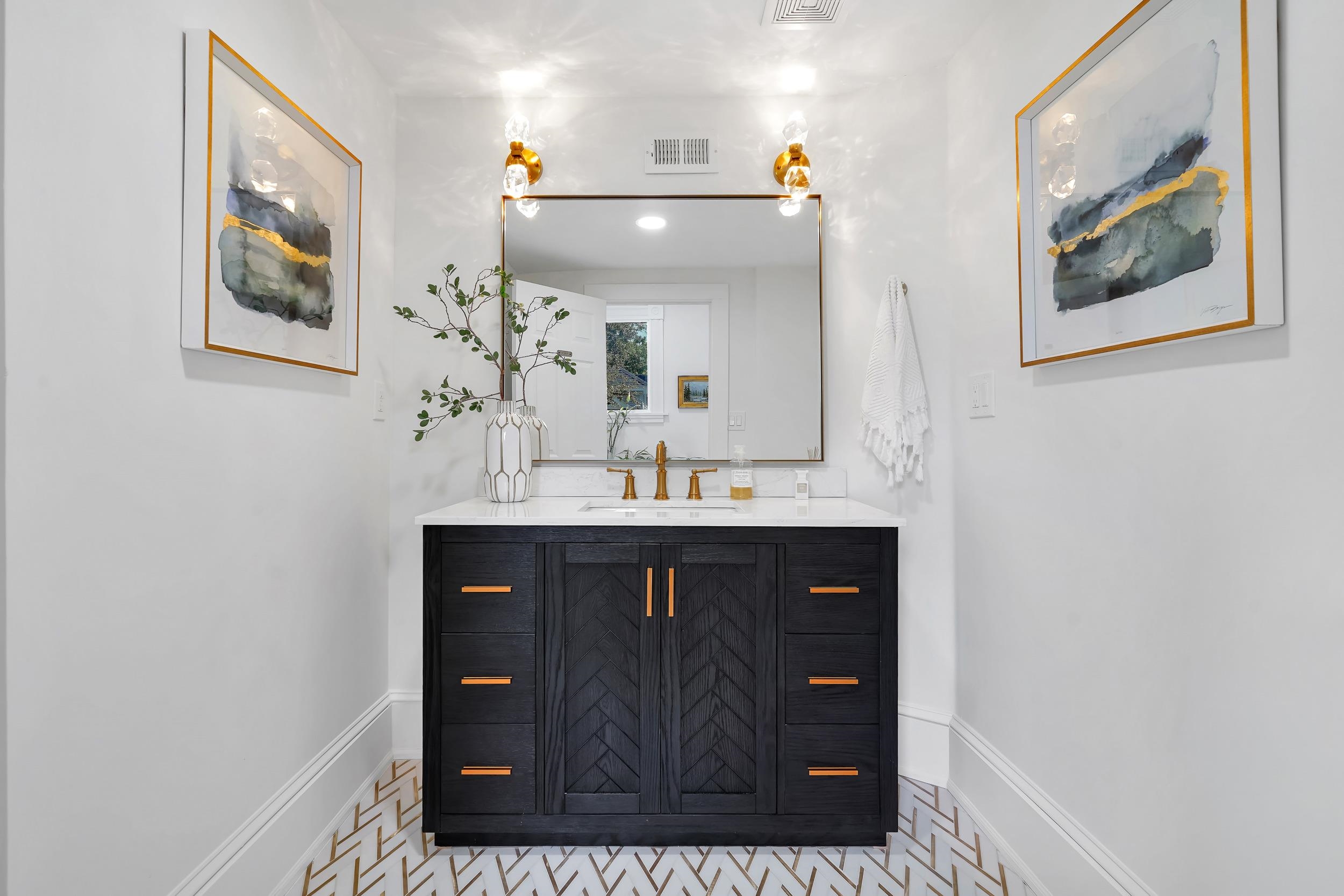 268 St George Street St. Augustine, FL 32084 - Photo 17 of 71 a bathroom with a sink and a mirror