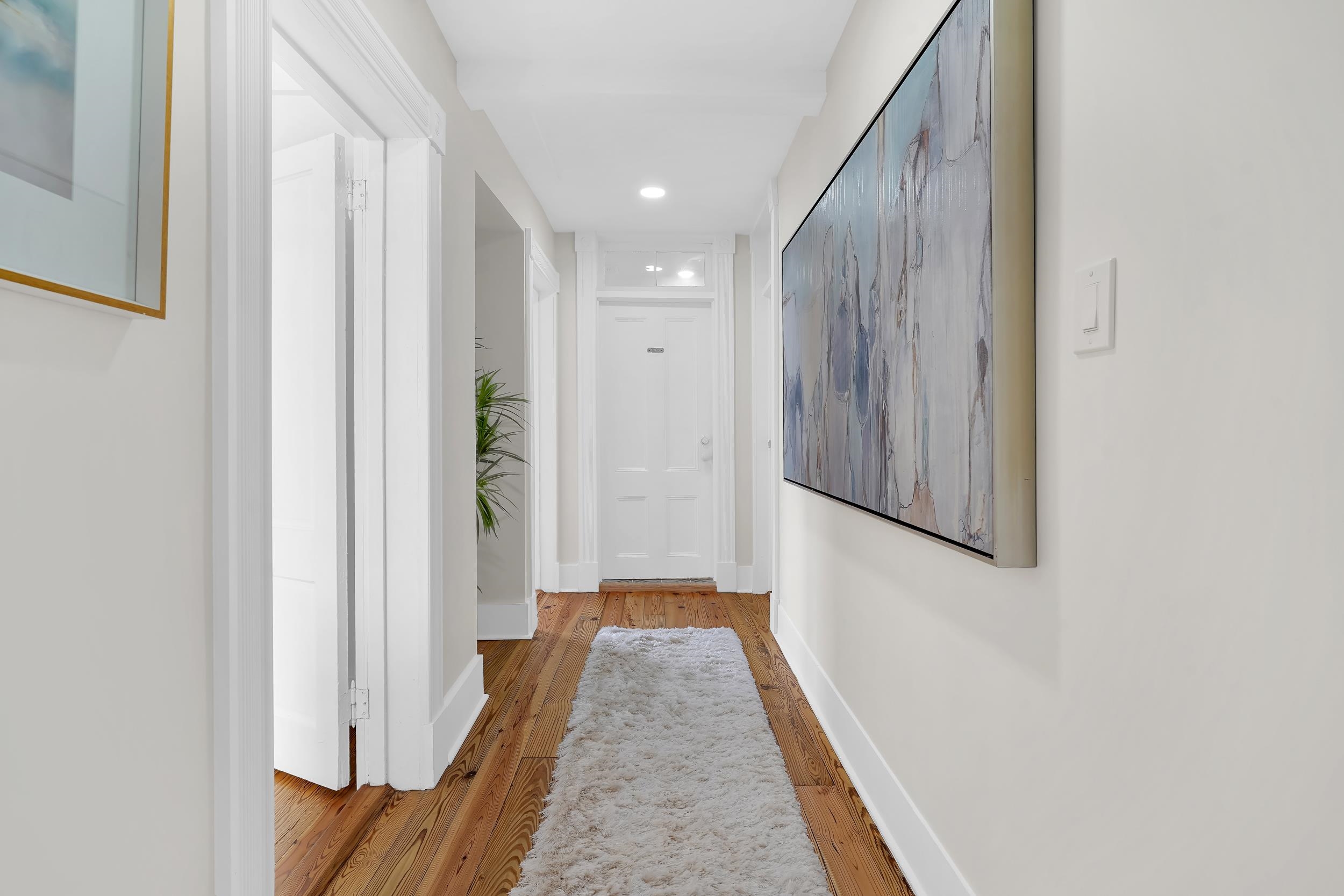 268 St George Street St. Augustine, FL 32084 - Photo 18 of 71 a view of a hallway with wooden floor and staircase