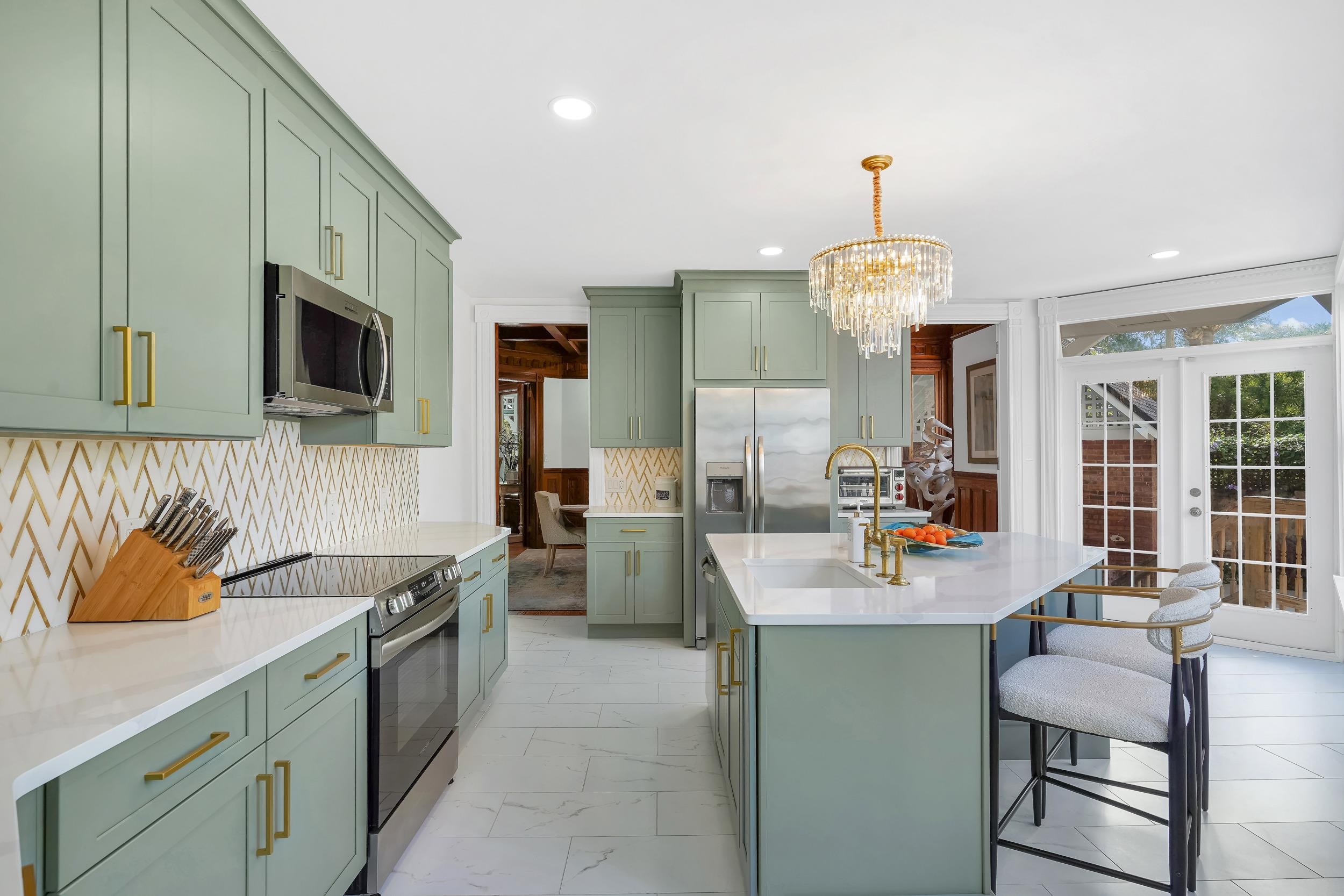 268 St George Street St. Augustine, FL 32084 - Photo 20 of 71 a kitchen with a sink cabinets and window