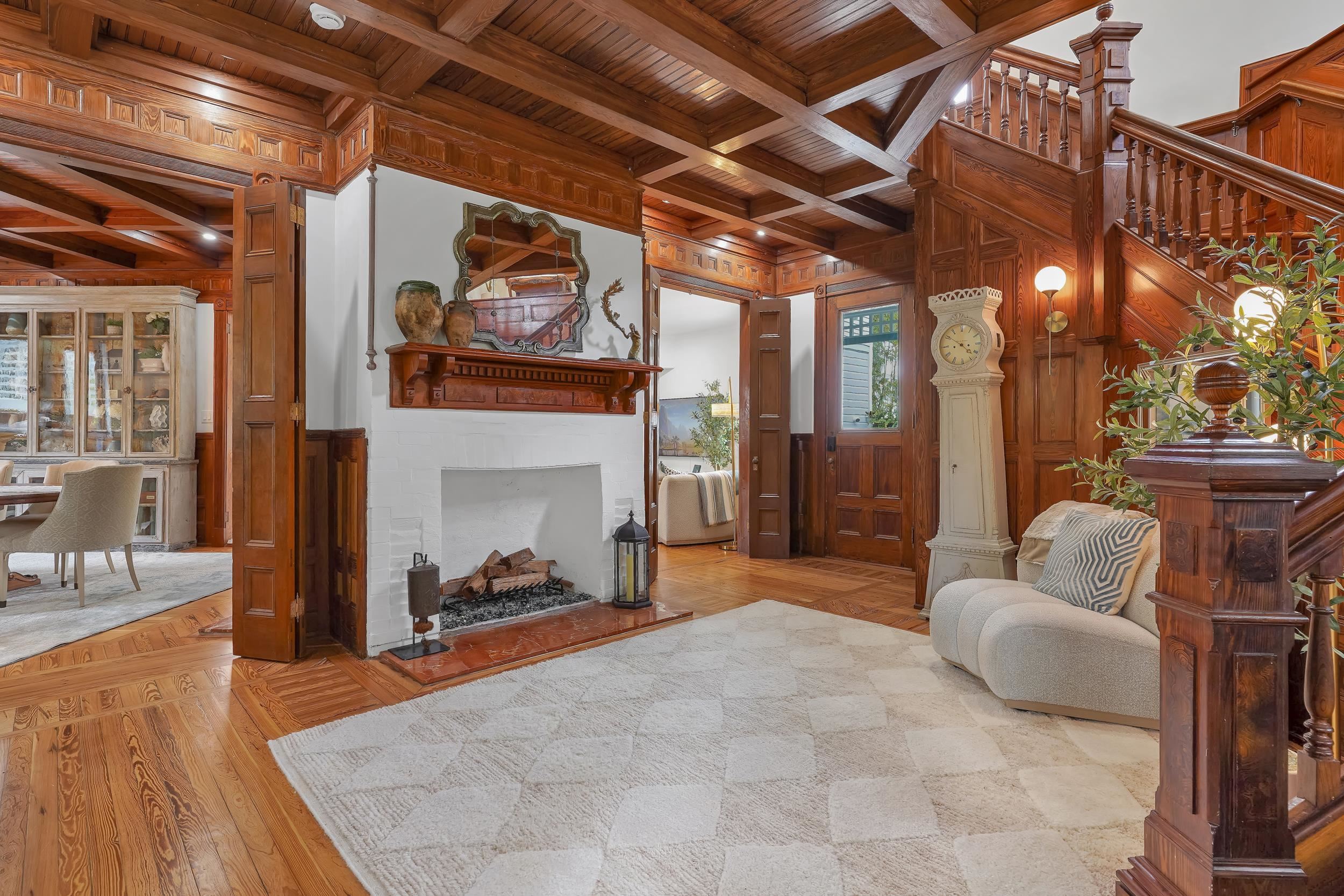 268 St George Street St. Augustine, FL 32084 - Photo 2 of 71 a living room with furniture and a fireplace