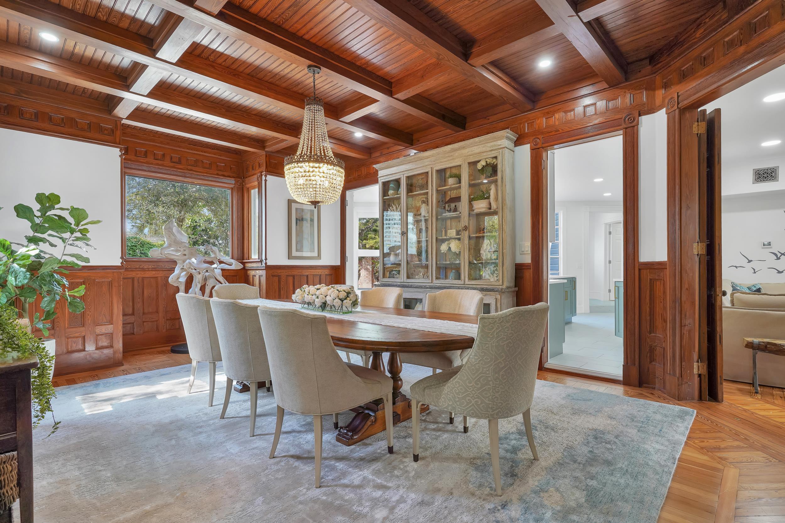 268 St George Street St. Augustine, FL 32084 - Photo 3 of 71 a dining room with furniture a chandelier and wooden floor