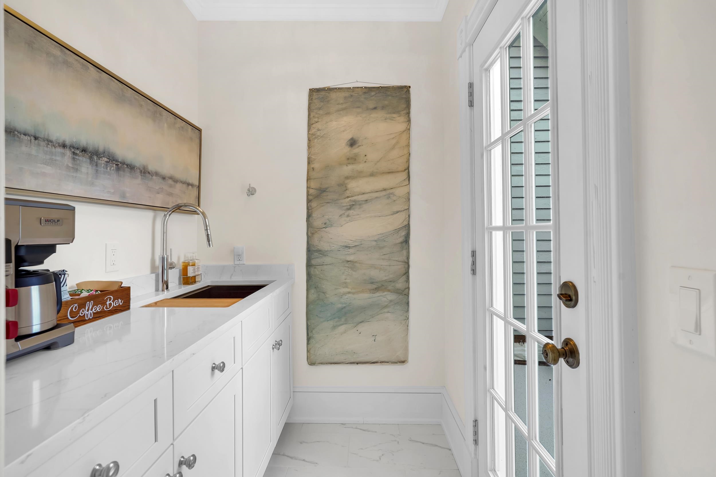 268 St George Street St. Augustine, FL 32084 - Photo 36 of 71 a bathroom with a granite countertop sink a mirror and shower