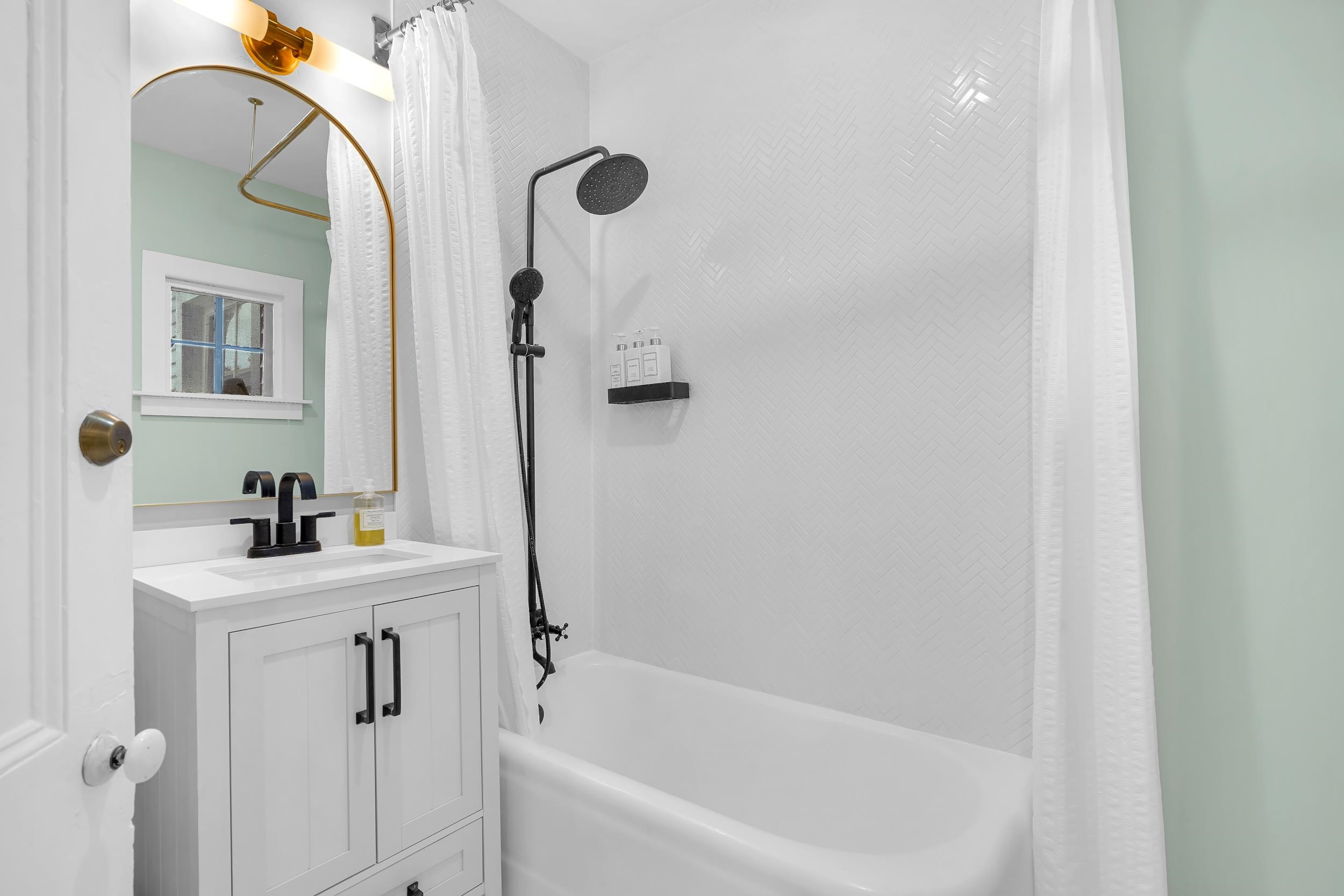 268 St George Street St. Augustine, FL 32084 - Photo 37 of 71 a bathroom with a sink a toilet and shower