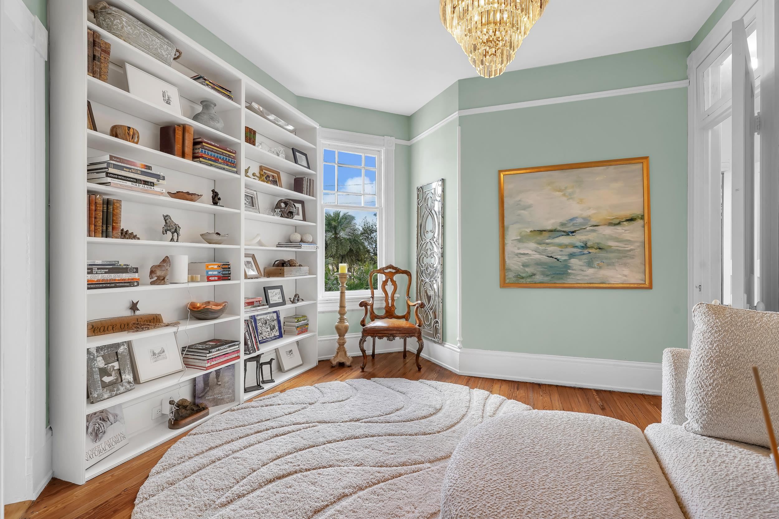 268 St George Street St. Augustine, FL 32084 - Photo 38 of 71 a bedroom with a bed and a book shelf