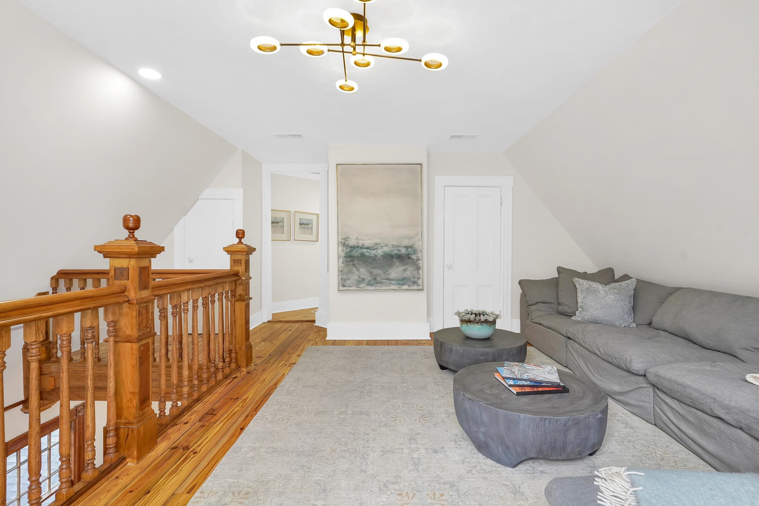 268 St George Street St. Augustine, FL 32084 - Photo 40 of 71 a living room with furniture and a chandelier