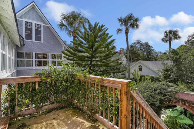 an aerial view of lake and residential houses with outdoor space