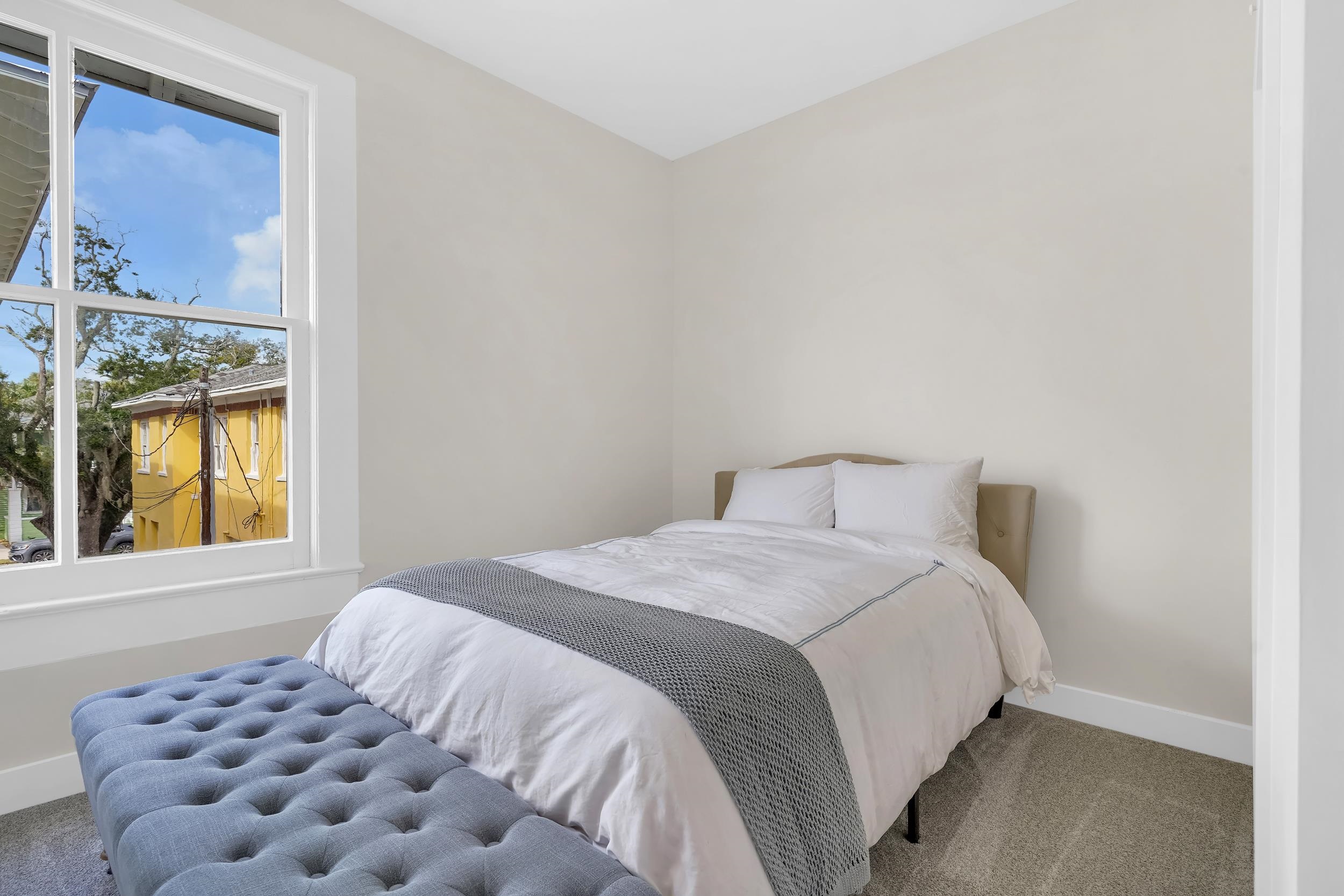 268 St George Street St. Augustine, FL 32084 - Photo 54 of 71 a bedroom with a bed and a window