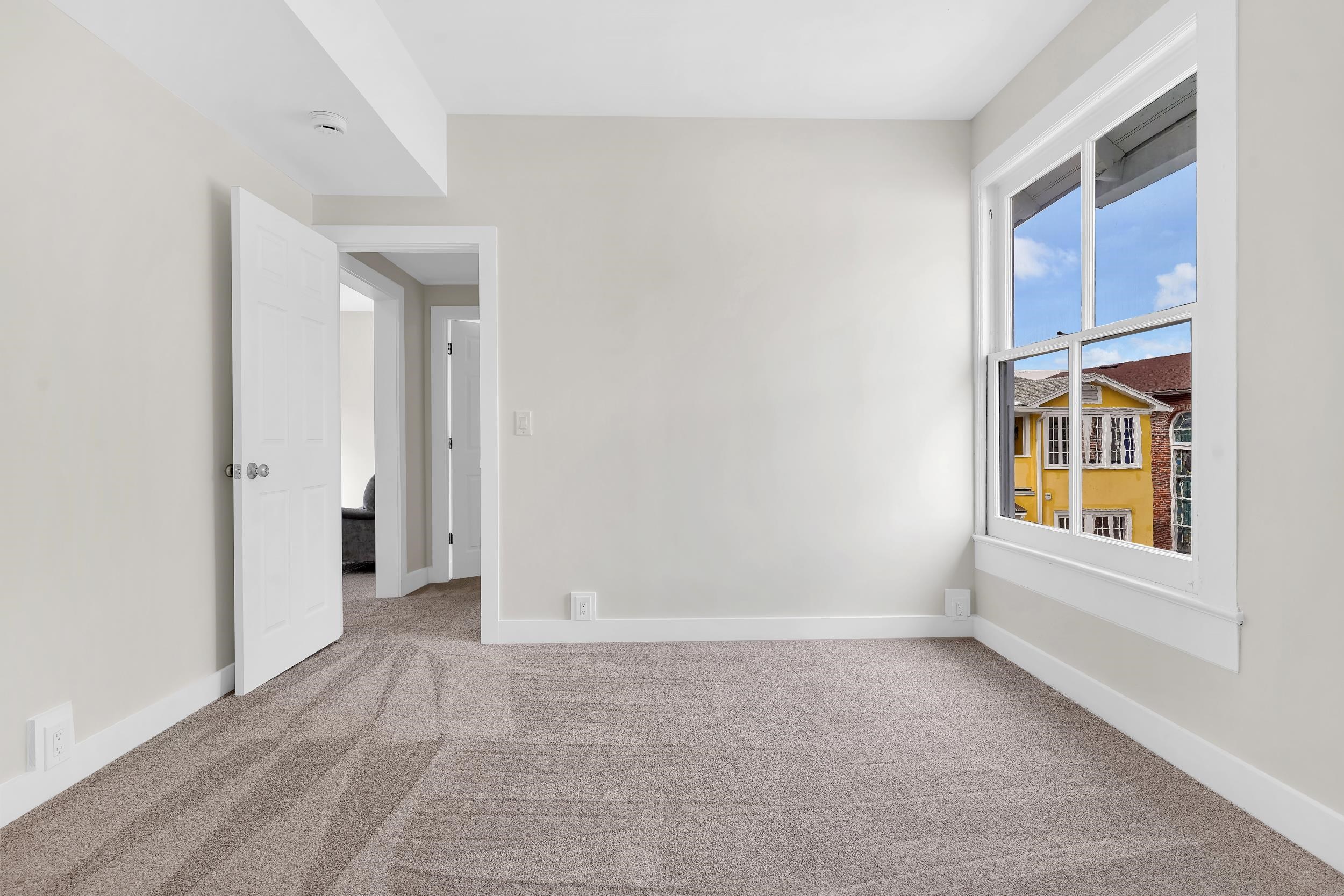 268 St George Street St. Augustine, FL 32084 - Photo 57 of 71 Empty room with light colored carpet and baseboards