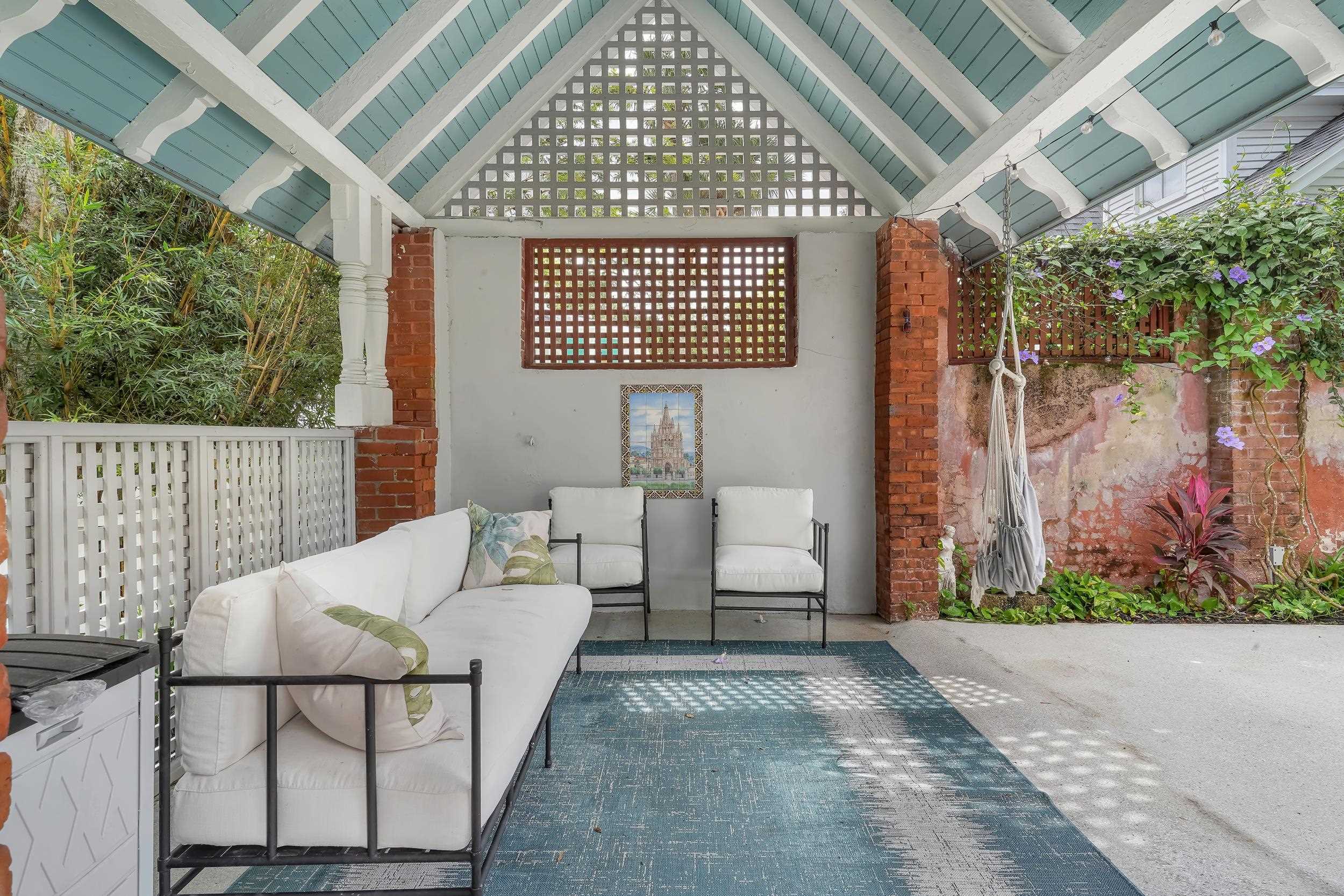 268 St George Street St. Augustine, FL 32084 - Photo 6 of 71 a view of a porch with furniture and garden