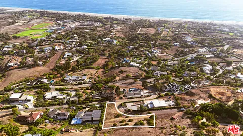 an aerial view of residential house with parking space