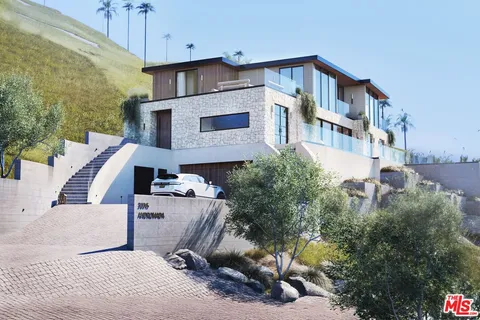 a front view of a house with yard and windows