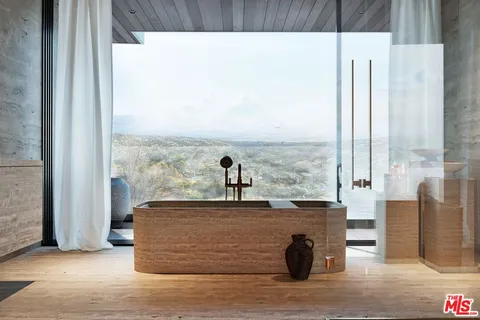 a view of living room with furniture and floor to ceiling window