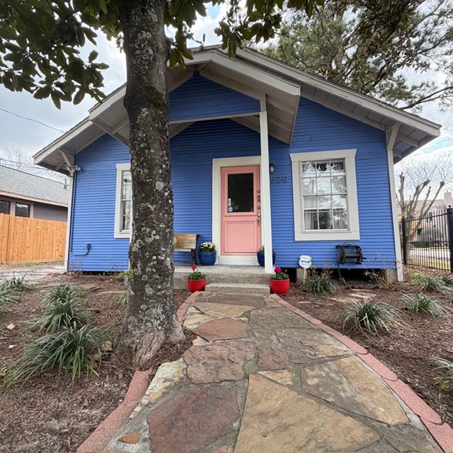 a front view of a house with garden