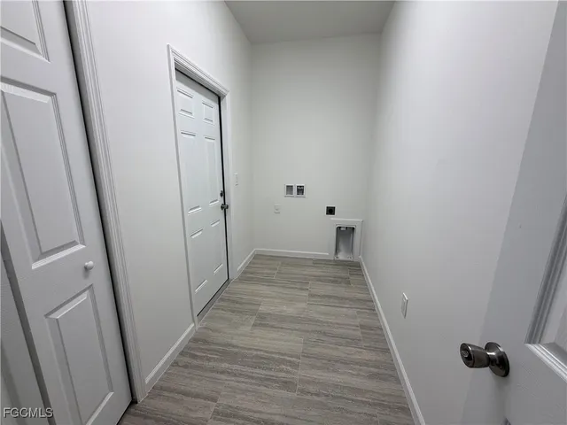 a car parked in front of a house with a yard