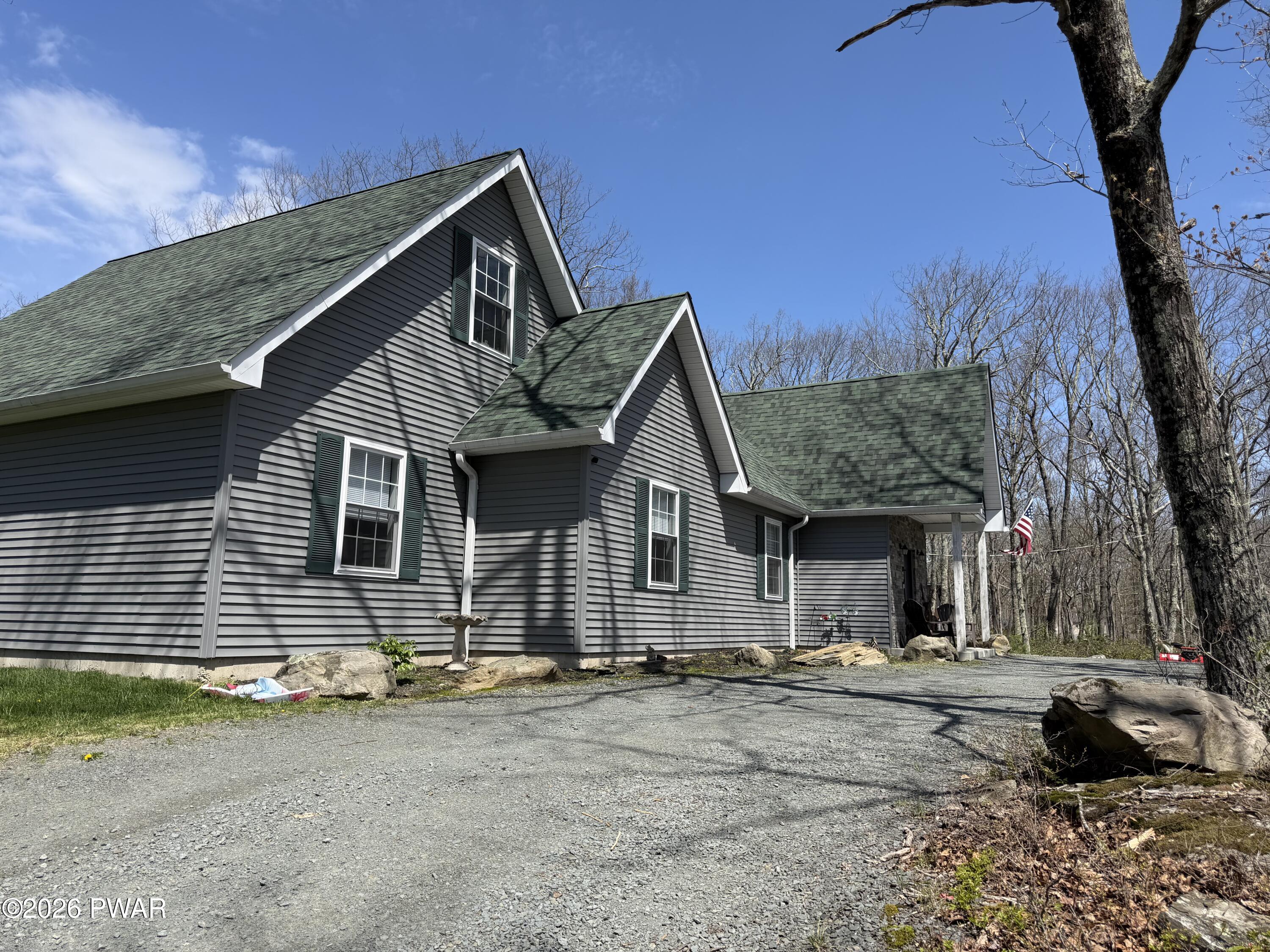 801 Maple Ridge Court Hawley, PA 18428 - Photo 2 of 55 a front view of a house with a yard