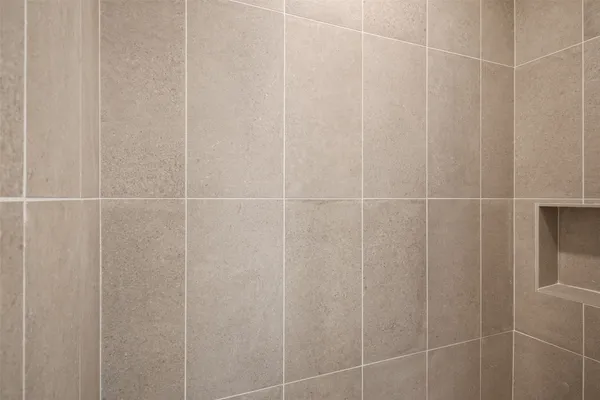 a bathroom with a shower curtain and a shower curtain