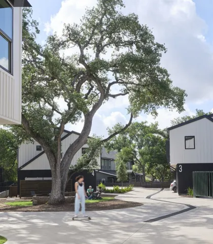 a view of a tree in front of a house