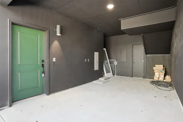 a bedroom with a bed and a large mirror