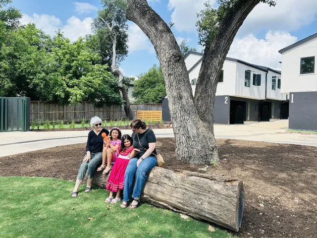 a view of swimming pool with a backyard and trees