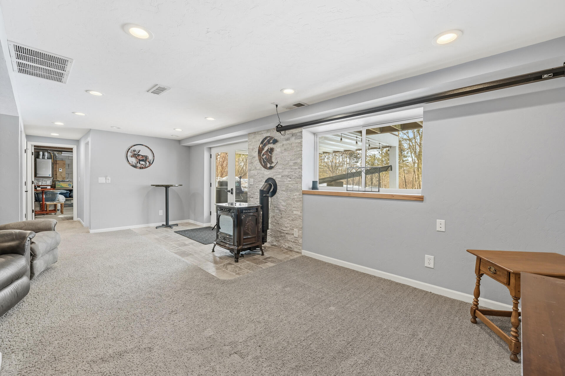 W245N4749 Swan Road Pewaukee, WI 53072 - Photo 21 of 36 Rec Room Pellet Stove to Patio