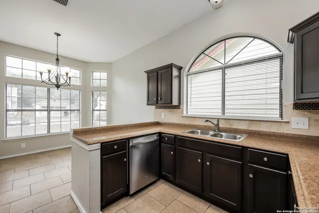 a kitchen with a sink and a window