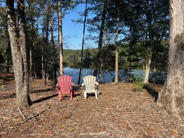 a view of a backyard with sitting area